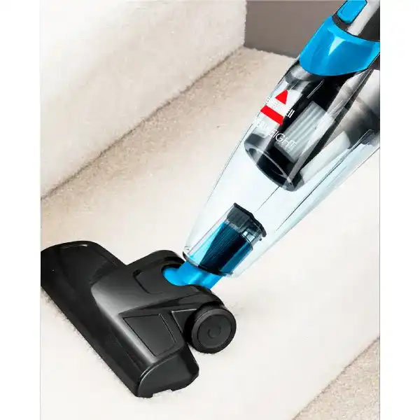 جاروشارژی ایستاده بیسل feather weight 2024E درحال جارو زدن مبل