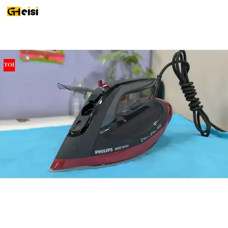 اتو بخار 2800 وات فیلیپس مدل DST6130 رنگ مشکی قرمز روی پارچه آبی
